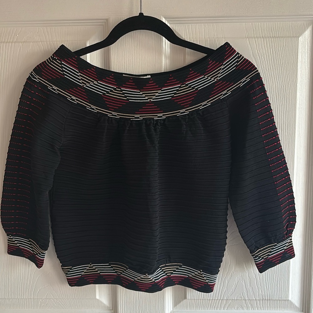 Maje size 2 boatneck top . Black with geometric details.